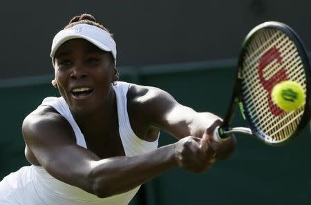 Venus Williams of the U.S.A. hits a shot during her match against Aleksandra Krunic of Serbia at the Wimbledon Tennis Championships in London, July 3, 2015. REUTERS/Stefan Wermuth