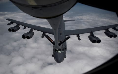 A U.S. Air Force B-52H Stratofortress bomber assigned to the 20th Expeditionary Bomb Squadron refuels during a mission over the middle east - Credit: HANDOUT/Reuters