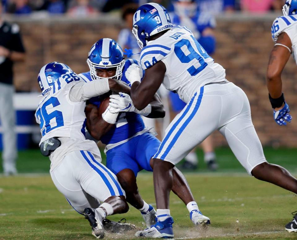 Jordan Waters is brought down by Joshua Pickett and R.J. Oben during Duke’s spring football game on Friday, April 21, 2023, at Wallace Wade Stadium in Durham, N.C.