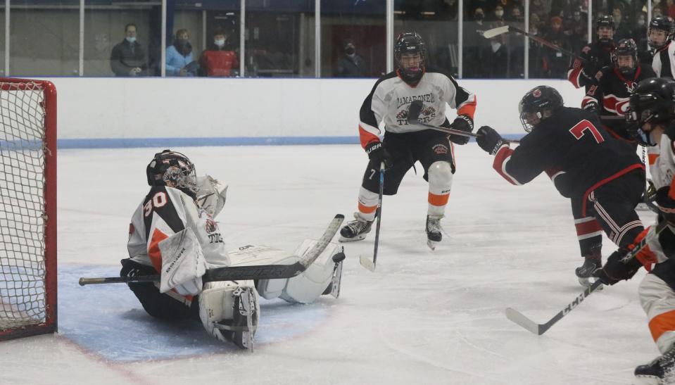 Mamaroneck goalie Max Baker stops a shot by Rye's Brian Curranduring their game at Hommocks Dec. 3, 2021. Rye won 4-3 in OT.