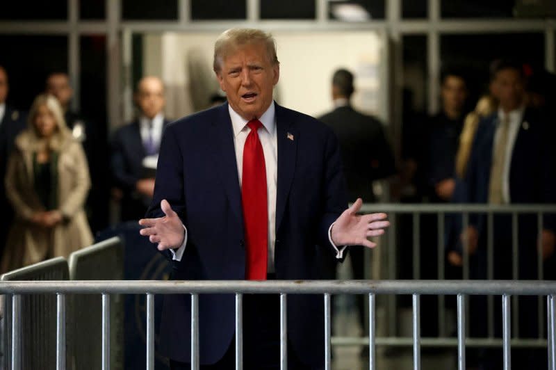 Former President Donald Trump (pictured speaking to reporters Thursday) said he had "no idea" if he would pay fines imposed on him if he is found guilty of violating a gag order in the trial. Pool Photo by Jefferson Siegel/UPI