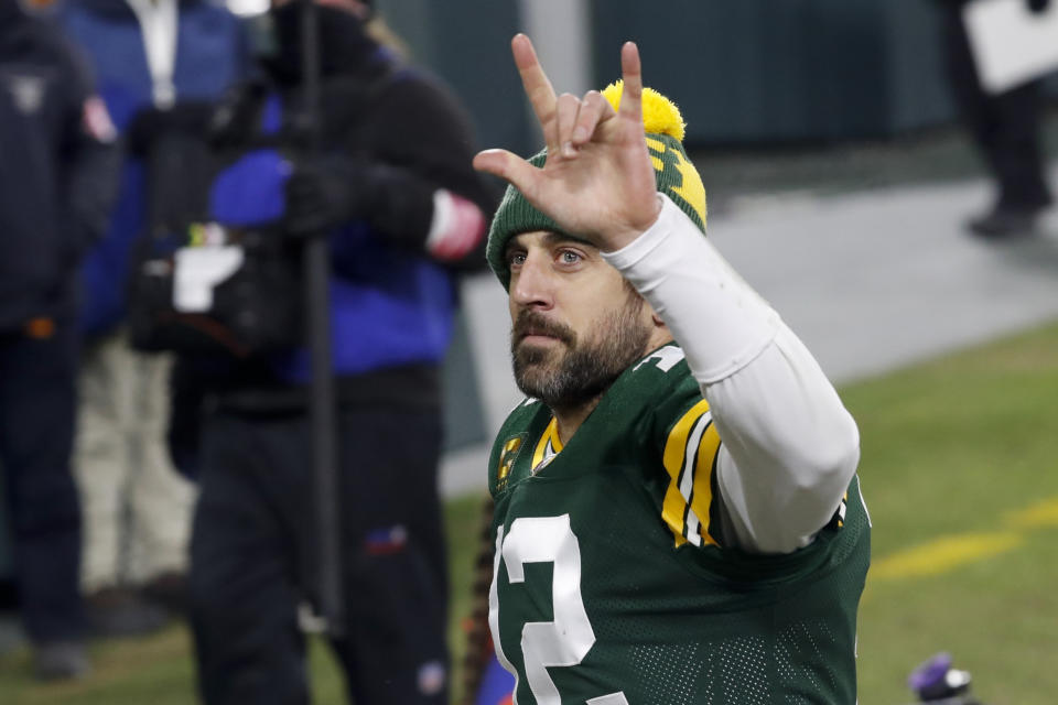 Green Bay Packers quarterback Aaron Rodgers waves to spectators after an NFL divisional playoff football game against the Los Angeles Rams Saturday, Jan. 16, 2021, in Green Bay, Wis. The Packers defeated the Rams 32-18 to advance to the NFC championship game. (AP Photo/Mike Roemer)