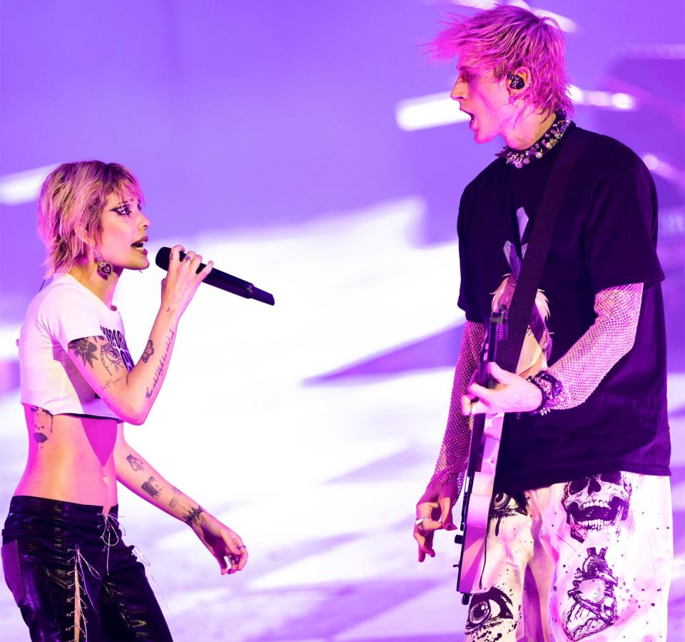 <p>Halsey joins Machine Gun Kelly on stage during his performance in Los Angeles on July 13. </p>