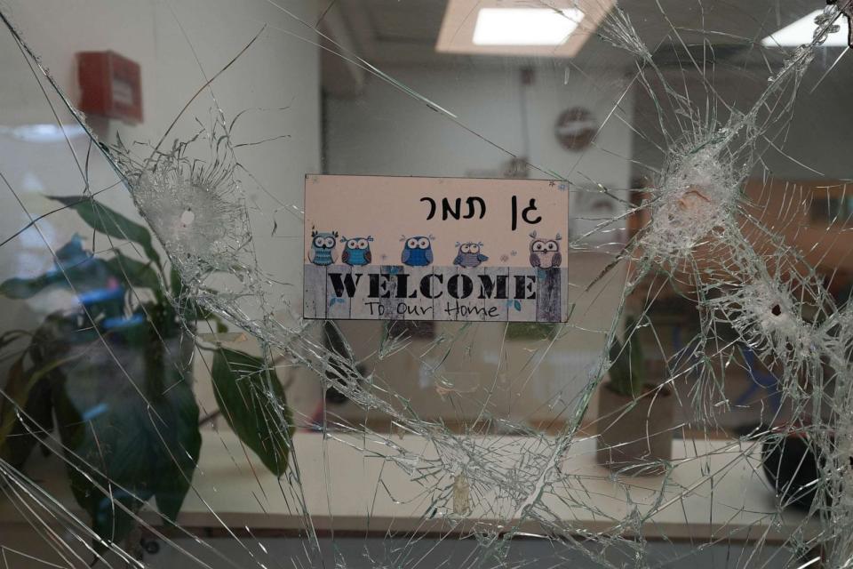 PHOTO: A bullet-shuttered window of the entrance to a kindergarten is seen in Kibbutz Be'eri, Oct. 11, 2023. (Baz Ratner/AP)