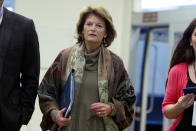 Sen. Lisa Murkowski, R-Alaska, walks to the Senate chamber, on Capitol Hill in Washington, Wednesday, Jan. 22, 2020, to attend the impeachment trial of President Donald Trump on charges of abuse of power and obstruction of Congress. (AP Photo/Jose Luis Magana)