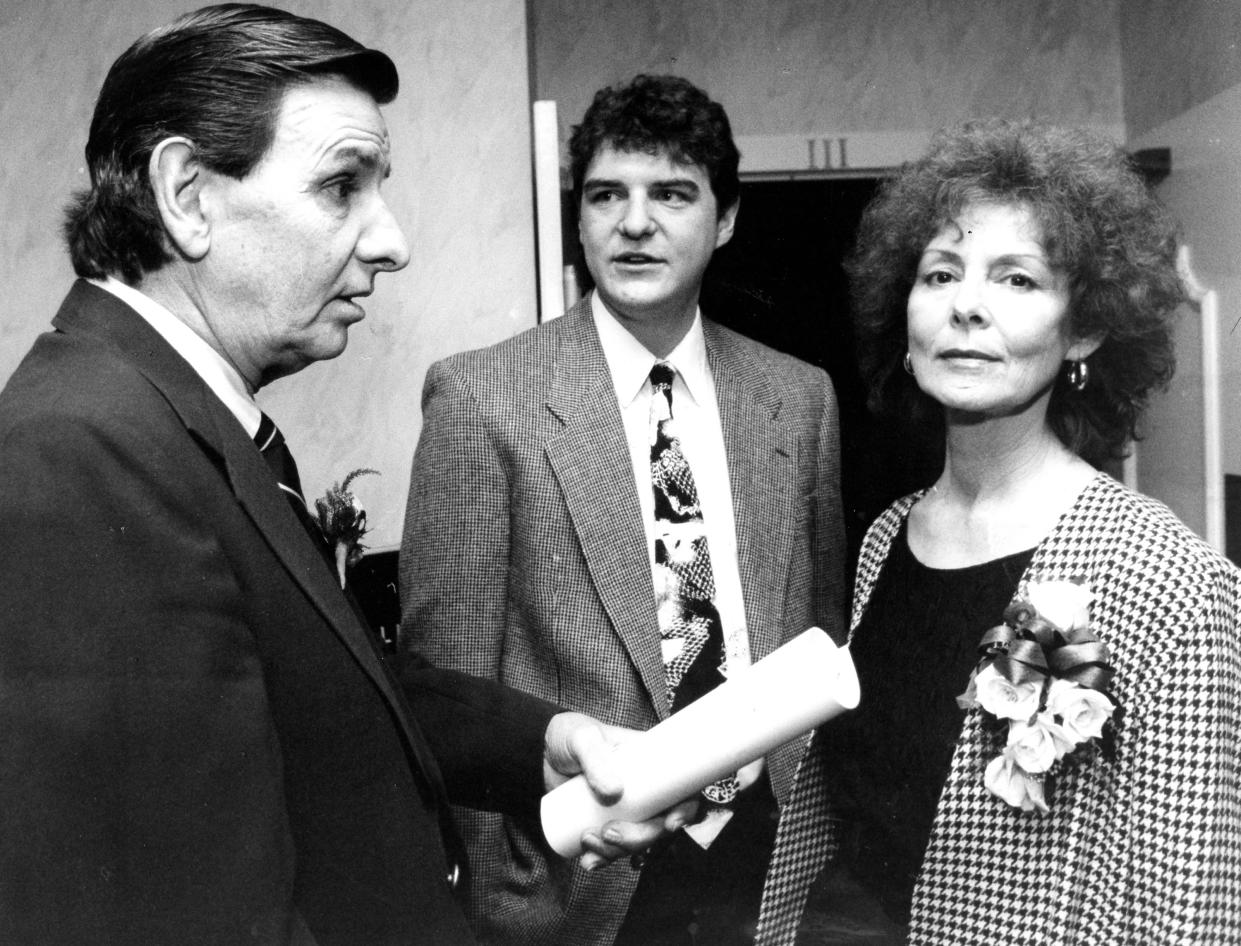 The late Barberton High School basketball coaching legend Jack Greynolds Sr. with his son Jack Greynolds Jr. and wife, Mary, in November 1999.