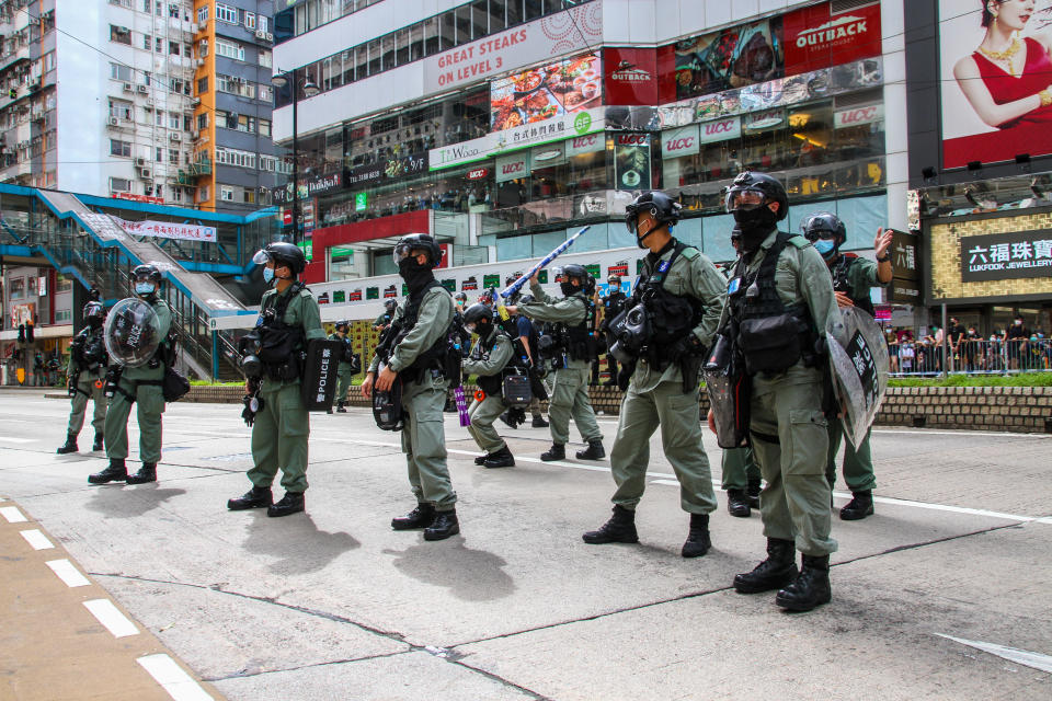 Police wait to disperse crowds during protests in Hong Kong, China on  July 1, 2020. (Photo by Tommy Walker/NurPhoto via Getty Images)