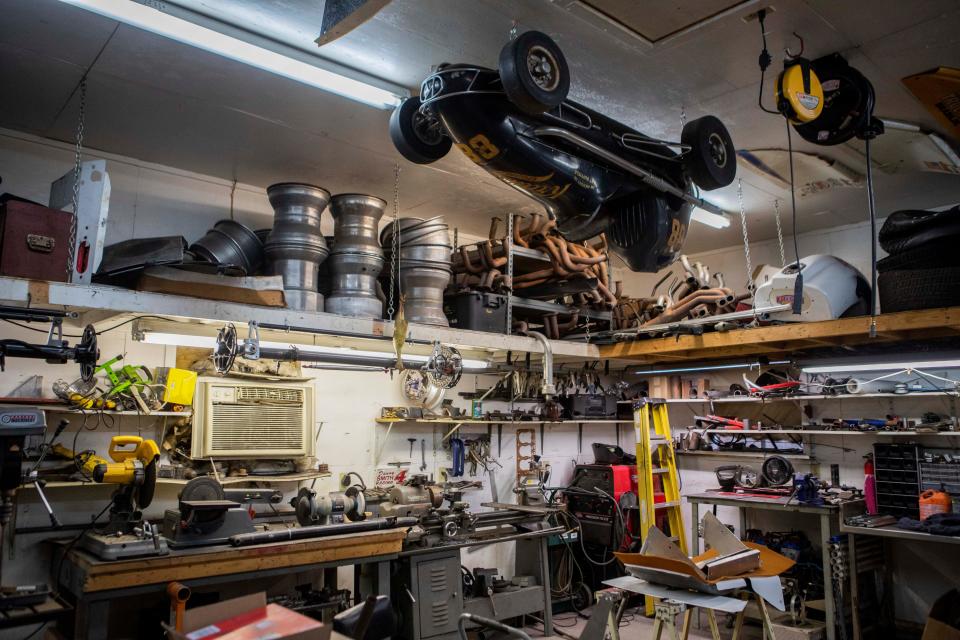 Antique racing cars hang from the ceiling and car parts line the shelves and floor in Danny Smith's garage, a legend in the national Sprint Car racing circuit, at his home on Jan. 10, 2023 in Chillicothe, Ohio. Danny has been racing for decades and won his first race in 1976. 