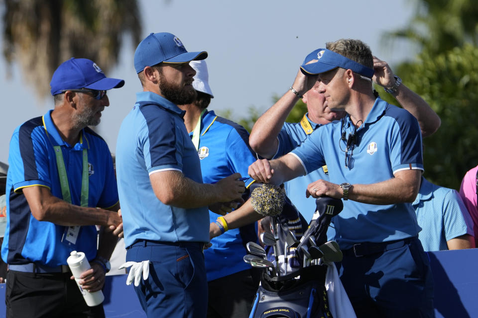 Europe's Tyrrell Hatton, left speaks to Europe's Team Captain Luke Donald on the 10th tee during a practice round ahead of the Ryder Cup at the Marco Simone Golf Club in Guidonia Montecelio, Italy, Wednesday, Sept. 27, 2023. The Ryder Cup starts Sept. 29, at the Marco Simone Golf Club. (AP Photo/Alessandra Tarantino)