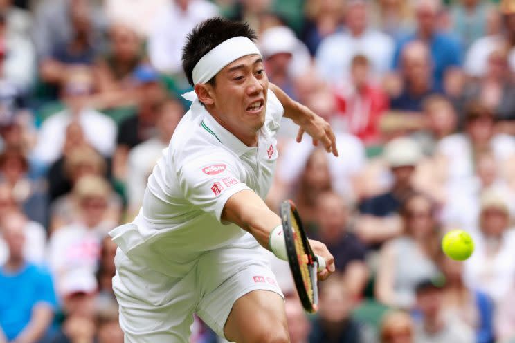 <p>Kei Nishikori of Japan plays a forehand during the Men’s Singles second round match against Julien Benneteau of France on day four of the Wimbledon Lawn Tennis Championships at the All England Lawn Tennis and Croquet Club on June 30, 2016 in London, England. (Photo by Adam Pretty/Getty Images)</p>