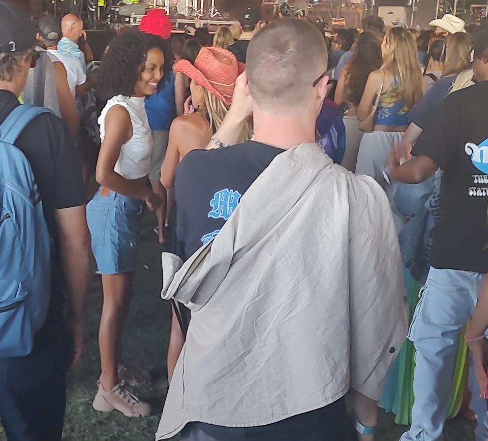 Actress Yara Shahidi, left in white top, was spotted in the VIP area while she attended a performance by BENEE on Friday at the Coachella Valley Music and Arts Festival