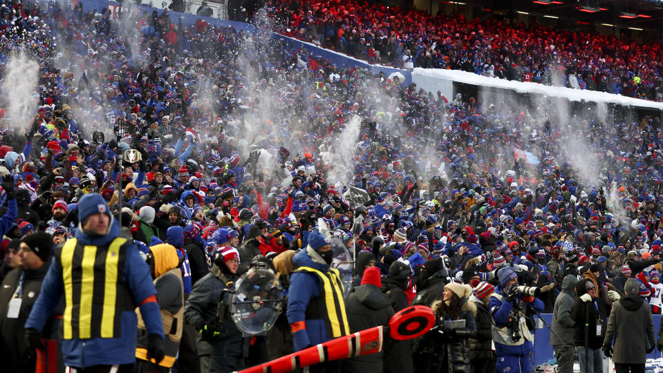 Buffalo Bills fans throw snow in the air after the Bills scored a touchdown against the Pittsburgh Steelers during the first quarter of an NFL wild-card playoff football game, Monday, Jan. 15, 2024, in Buffalo, N.Y. (AP Photo/Jeffrey T. Barnes)