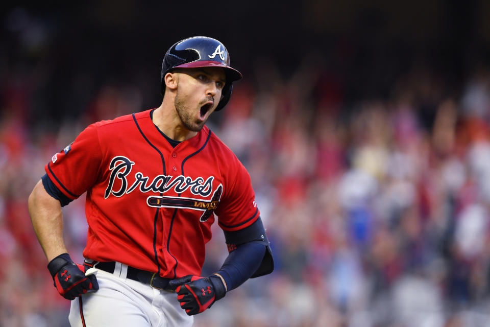 Atlanta Braves Adam Duvall (23) runs the bases after hitting a two-run homer against the St. Louis Cardinals in the seventh inning during Game 2 of a best-of-five National League Division Series, Friday, Oct. 4, 2019, in Atlanta. (AP Photo/John Amis)