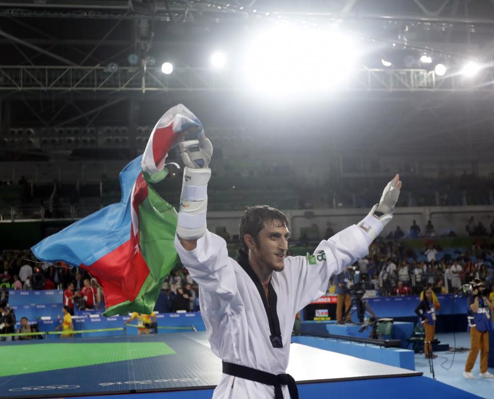 <p>Radik Isaev of Azerbaijan celebrates after beating Abdoulrazak Issoufou Alfaga of Niger in a men’s over 80-kg gold medal Taekwondo event at the 2016 Summer Olympics in Rio de Janeiro, Brazil, Saturday, Aug. 20, 2016. (AP Photo/Marcio Jose Sanchez) </p>