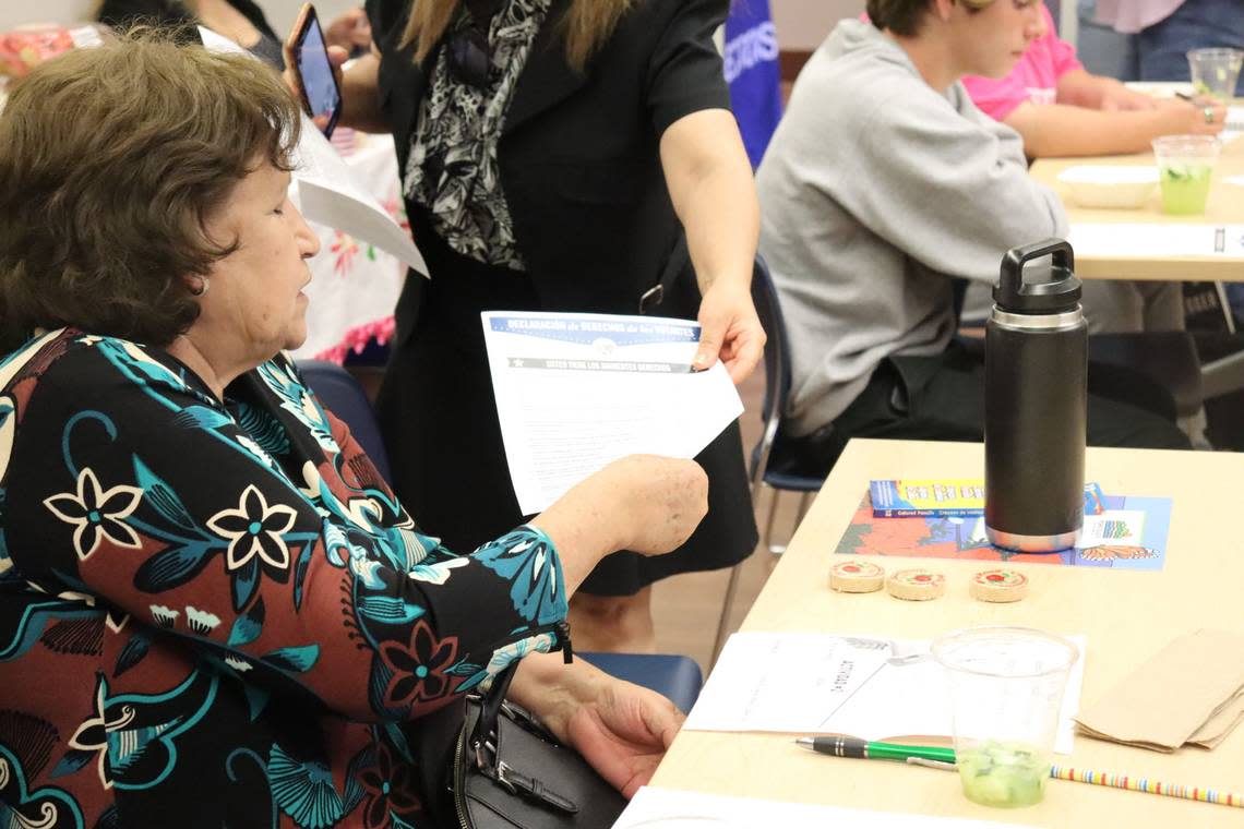 An attendee at the LatinX Voter Empowerment Workshop at the Nipomo library on Sept. 11, 2024, receives Spanish resources on registering and voting. Two events have been held so far in Atascadero and Nipomo, and four more are planned over the coming weeks in San Miguel, Cambria, Oceano and San Luis Obispo.