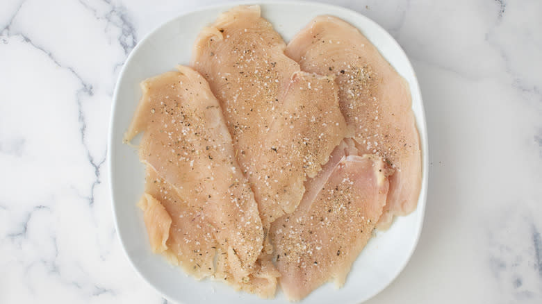 seasoned chicken cutlets on plate