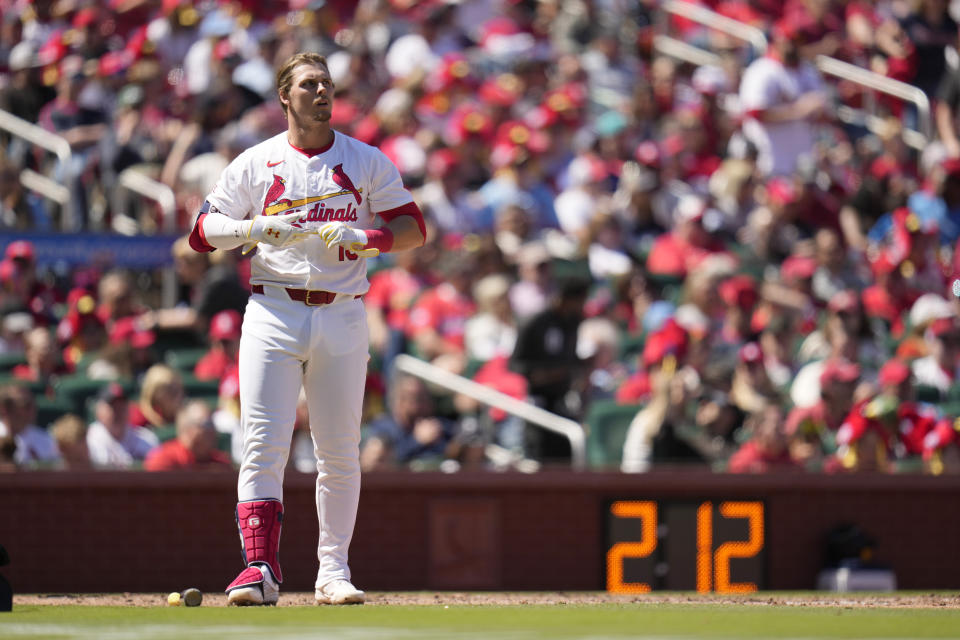 St. Louis Cardinals' Nolan Gorman removes his batting gloves after striking out to end the sixth inning of a baseball game against the Milwaukee Brewers Sunday, April 21, 2024, in St. Louis. (AP Photo/Jeff Roberson)
