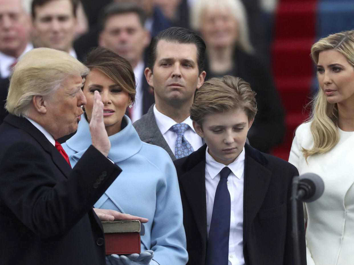 U.S. President Donald Trump takes the oath of office from U.S. Supreme Court Chief Justice John Roberts with his wife Melania, and children Barron, Donald, Ivanka and Tiffany at his side during inauguration ceremonies at the Capitol in Washington DC: Reuters