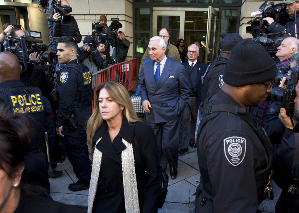 Former campaign adviser for President Donald Trump, Roger Stone leaves the federal court in Washington, Thursday, Feb. 21, 2019, as his daughter Adria, Stone walks in front of him. (AP Photo/Jose Luis Magana)