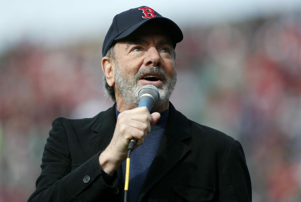 FILE - This April 20, 2013 file photo shows Neil Diamond singing "Sweet Caroline" during a baseball game in Boston between the Boston Red Sox and the Kansas City Royals, the first home game since the Boston Marathon explosions. Diamond’s “Sweet Caroline,” Earth, Wind & Fire’s “September” and Sam & Dave’s “Soul Man" are among 25 recordings being inducted to the National Recording Registry. (AP Photo/Michael Dwyer, File)