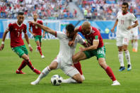 Soccer Football - World Cup - Group B - Morocco vs Iran - Saint Petersburg Stadium, Saint Petersburg, Russia - June 15, 2018 Iran's Karim Ansarifard in action with Morocco's Nordin Amrabat REUTERS/Henry Romero