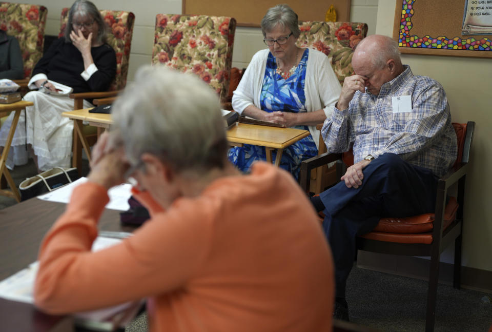 Members of Fern Creek Baptist Church pray during Bible study, Sunday, May 21, 2023, in Louisville, Ky. (AP Photo/Jessie Wardarski)