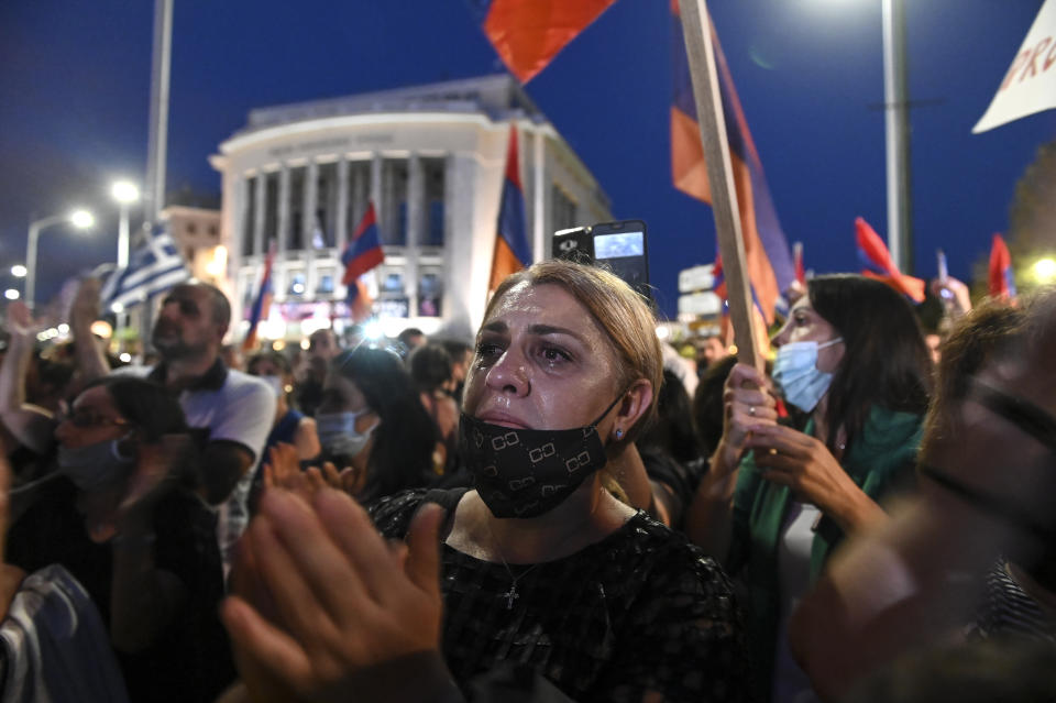 Protesters take part in a demonstration in support of Armenia, in the northern city of Thessaloniki, Greece, Saturday, Oct. 3, 2020. Heavy fighting between Armenia and Azerbaijan continued Saturday in their conflict over the separatist territory of Nagorno-Karabakh, while Azerbaijan's president criticized the international mediators who have tried for decades to resolve the dispute. (AP Photo/Giannis Papanikos)