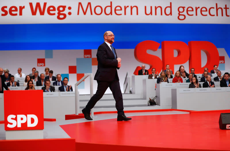 Social Democratic Party (SPD) leader Martin Schulz walks onto a podium during an SPD party convention in Berlin, Germany, December 7, 2017. REUTERS/Fabrizio Bensch