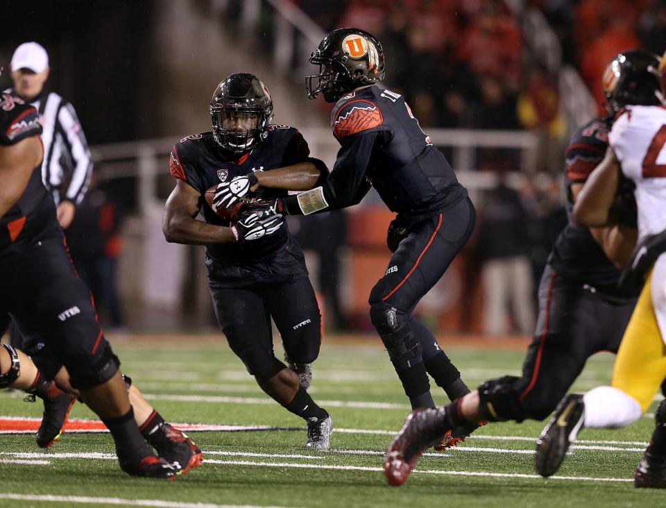 Utah Utes quarterback Troy Williams hands the ball off to Utah Utes running back Zack Moss during game against USC at Rice-Eccles Stadium in Salt Lake City on Friday, Sept. 23, 2016. | Laura Seitz, Deseret News