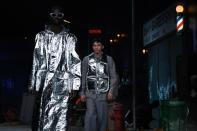 Virgil Abloh's show made reference to Iron Man, in the guise of a hooded aluminium foil knee-length coat worn with similarly reflective sunglasses