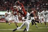 Wisconsin's Danny Davis III makes a catch over Army's Julian McDuffie during the first half of an NCAA college football game Saturday, Oct. 16, 2021, in Madison, Wis. (AP Photo/Morry Gash)