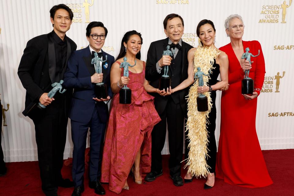 Harry Shum Jr., Ke Huy Quan, Stephanie Hsu, James Hong, Michelle Yeoh, and Jamie Lee Curtis, recipients of the Outstanding Performance by a Cast in a Motion Picture award for "Everything Everywhere All at Once,"