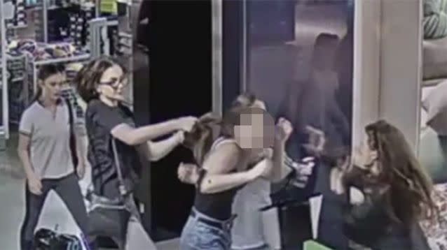 The group are seen assaulting two teens at a South Wharf shopping centre. Source: Victoria Police