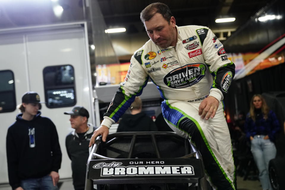 Ryan Newman gets into his car before the feature race during the 2022 Lucas Oil Chili Bowl Nationals presented by General Tire at Tulsa Expo Raceway in Tulsa, Oklahoma on January 14, 2022. (Nick Oxford/NASCAR)