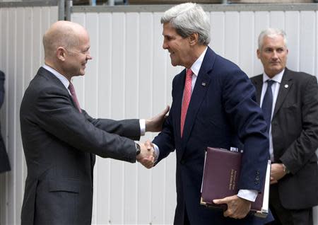 Britain's Foreign Secretary William Hague (L) greets U.S. Secretary of State John Kerry outside the Foreign Office in London September 9, 2013. REUTERS/Alastair Grant/Pool