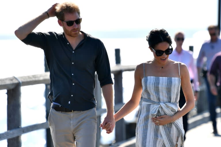 The pregnant Duchess of Sussex skipped most of the day's events on the island off Queensland state but joined her husband in the late afternoon