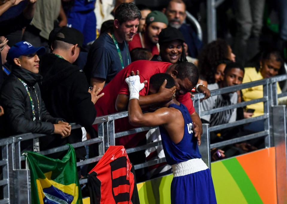 <p>Gary Russell of USA, is congratulated by his father Gary Snr following his Men’s Light Welterweight Preliminary bout with Richardson Hitchins of Haiti at the Riocentro Pavillion 6 Arena during the 2016 Rio Summer Olympic Games in Rio de Janeiro, Brazil. (Photo By Stephen McCarthy/Sportsfile Photo by Stephen McCarthy/Sportsfile via Getty Images) </p>