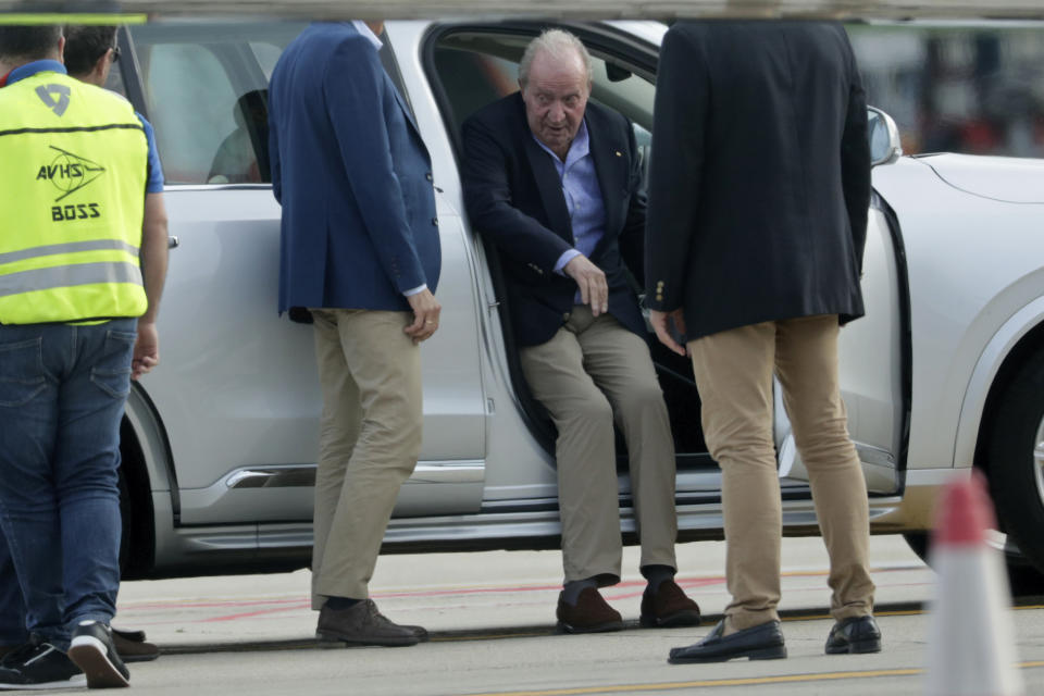 Spain's former King Juan Carlos gets into a car on arrival by private jet at the Peinador airport in Vigo, north western Spain, Thursday, May 19, 2022. Spain's former King has returned to Spain Thursday for his first visit since leaving nearly two years ago amid a cloud of financial scandals. (AP Photo/Lalo R. Villar)