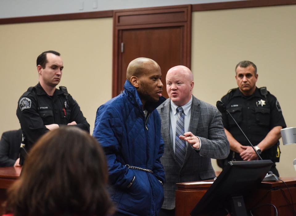 "You need to stop," Public Defender Steven Feigelson tells client Willie Charles Woods, 27, as Woods curses at Judge Rosemarie Aquilina during his sentencing hearing at Veteran's Courthouse in Lansing, Wednesday, April 5, 2023. He was sentenced to life in prison for murder.