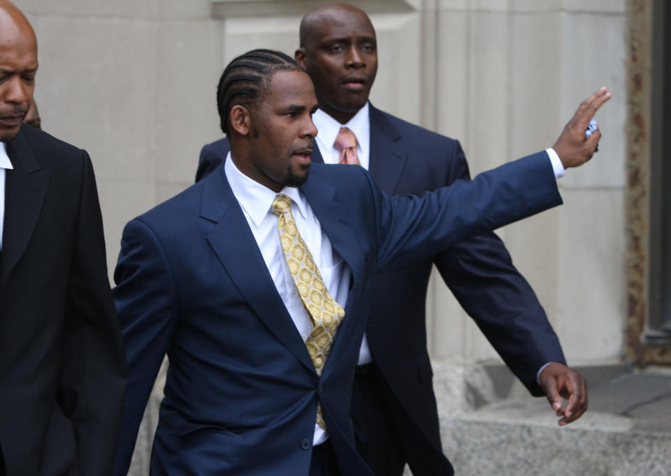 R&B star R. Kelly, 41, waves to supporters as he leaves the Cook County Criminal Courts Building after he was acquitted of child pornography charges Friday, June 13, 2008, in Chicago, Illinois. | Chicago Tribune—MCT via Getty Images