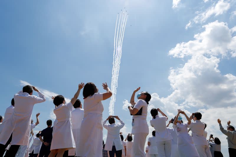 Japan Air Self-Defense Force stages a flyover to salute the medical workers at the frontline of the fight against the coronavirus disease (COVID-19), in Tokyo