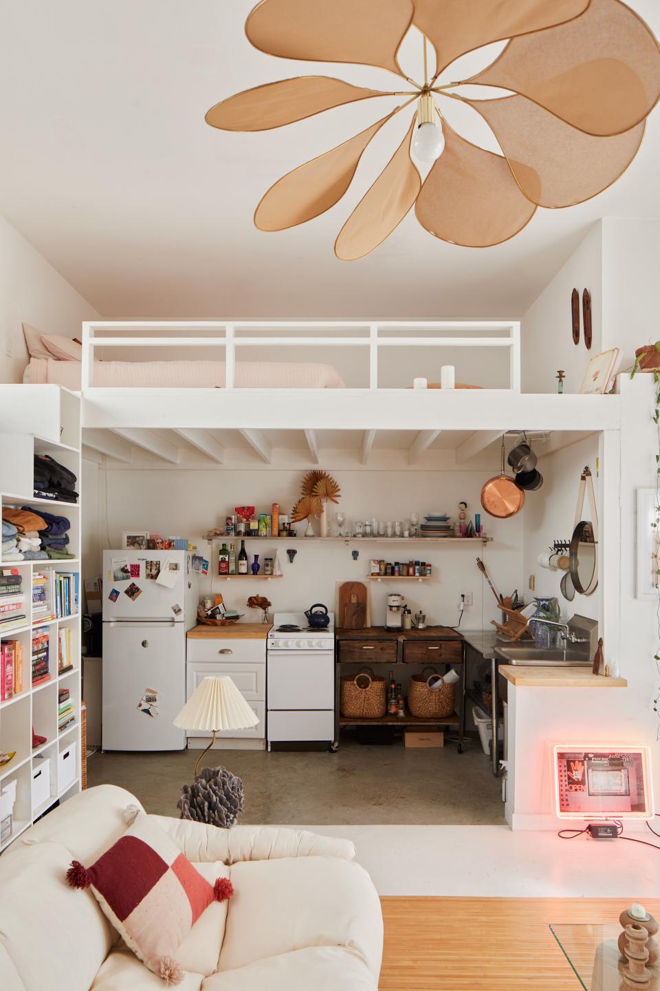 Sam Klemick knew that the lofted bed was going to be key to the apartment. “As soon as I knew I would be moving into this particular space, I wanted to do a lofted bed to utilize the additional space gifted by having such high ceilings,” she says.