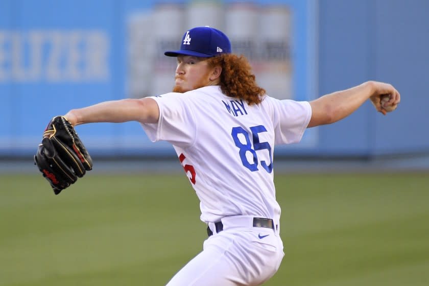 Los Angeles Dodgers starting pitcher Dustin May throws to the plate.