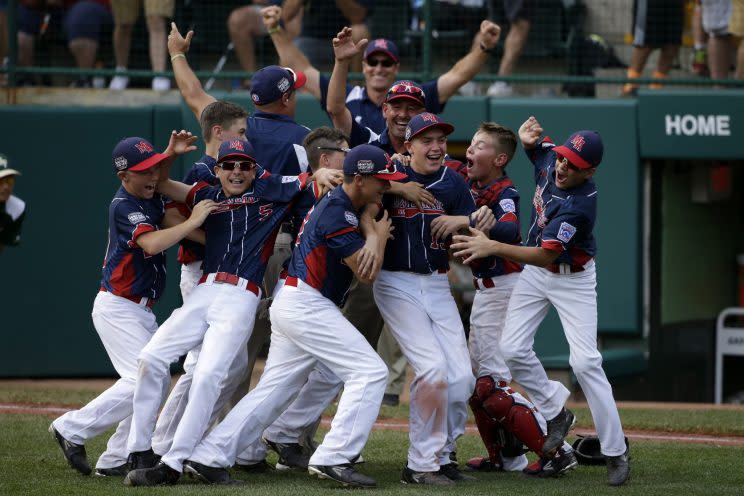 Endwell, N.Y. celebrates it's 2-1 win over South Korea in the Little League World Series Championship baseball game in South Williamsport, Pa., Sunday, Aug. 28, 2016. (AP Photo/Gene J. Puskar)