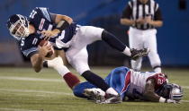 Toronto Argonauts quarterback Ricky Ray (15) is sacked by Montreal Alouettes linebacker Rod Davis (12) during first half CFL pre-season action in Toronto on Tuesday June 19, 2012. THE CANADIAN PRESS/FRANK GUNN