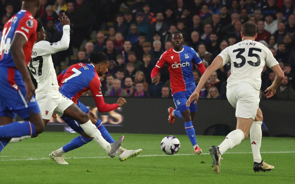 Crystal Palace's Michael Olise, centre, scores his side's opening goal during the English Premier League soccer match between Crystal Palace and Manchester Unite