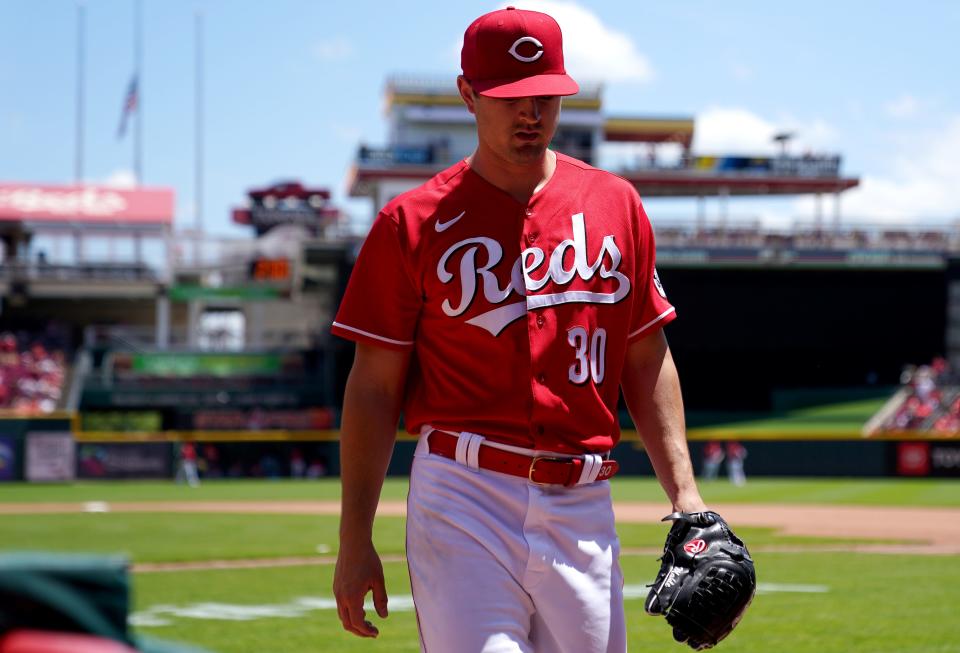 Cincinnati Reds starting pitcher Tyler Mahle (30) walks into the dugout after his no-hit bid ended in the seventh inning during a baseball game against the San Francisco Giants, Sunday, May 29, 2022, at Great American Ball Park in Cincinnati. The San Francisco Giants won, 6-4.