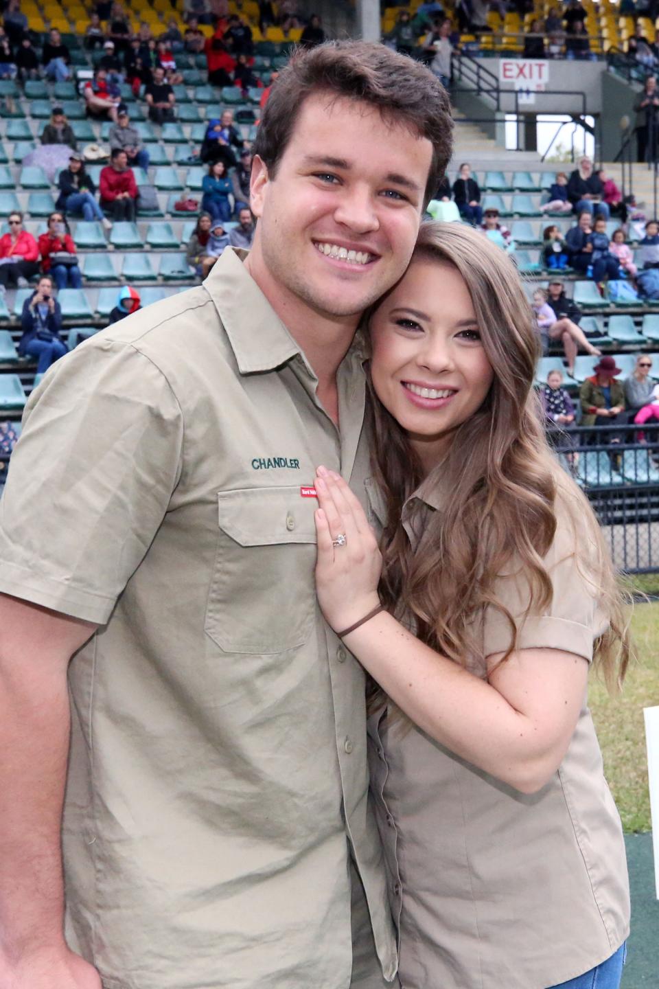 Bindi Irwin celebrates her 22nd birthday, joined by her husband Chandler Powell, brother Robert and mother Terri Irwin at Australia Zoo with A Cake Cutting & Family Crocodile Feeding in the " Crocoseum ", main stadium. 24 Jul 2020 Pictured: Bindi Irwin, Terri Irwin, Chandler Powell, Robert Irwin. Photo credit: A Carlile / MEGA TheMegaAgency.com +1 888 505 6342 (Mega Agency TagID: MEGA690315_045.jpg) [Photo via Mega Agency]