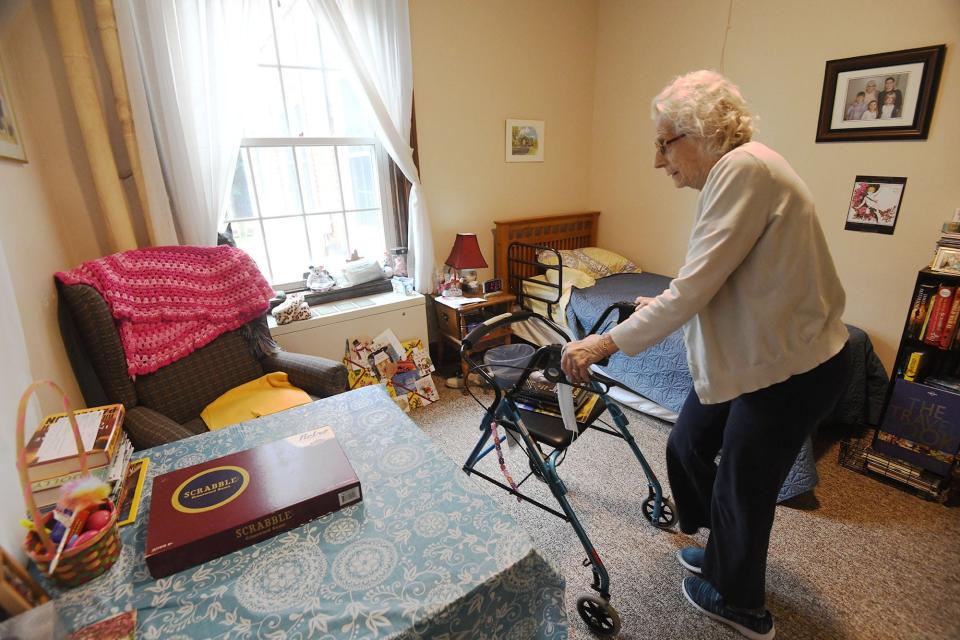 Sheltering Arms resident Marcia Smethurst, 95, enters her room Monday that may be getting a private bathroom tied to an announcement that the residence area of the 1926 Sheltering Arms for assisted living for the elderly will undergo $4.5 million in renovations in Norwich.