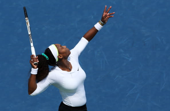 Serena Williams serves against Urszula Radwanska of Poland during day six of the Western & Southern Open at Lindner Family Tennis Center on August 16, 2012 in Mason, Ohio. (Photo by Nick Laham/Getty Images)